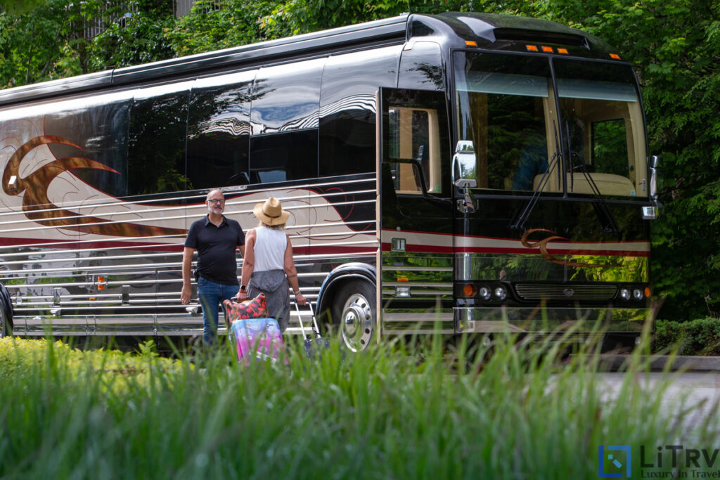 Luxury RV rental with driver greeting guest
